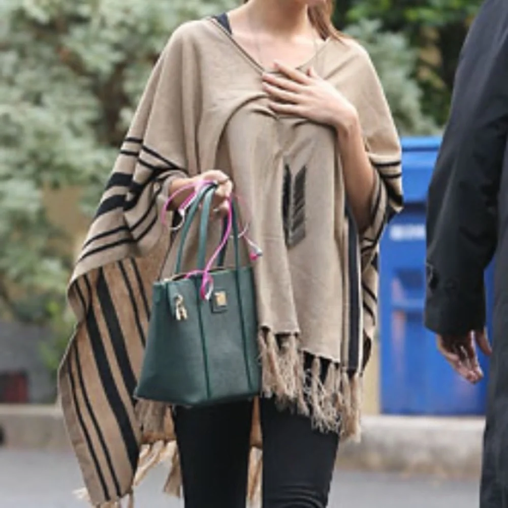 Forever 21 No Fuss Fringe Poncho as seen worn by Selena Gomez